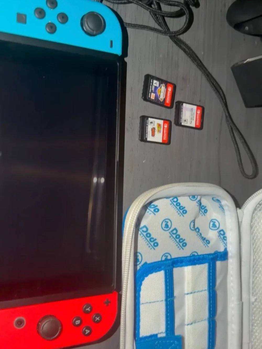 Nintendo Switch Red & Blue Handheld Console with Game Cards
